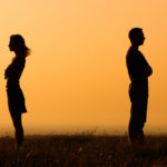 silhouette figures of divorcing couple