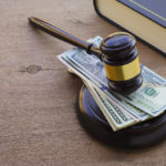 stack-of-cash-under-gavel-jpg-crdownload