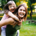 Little girl with special needs enjoy spending time with mother