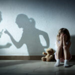 Little Girl Crying With Shadow Of Parents Arguing - Home Violence And Divorce