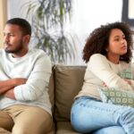 unhappy couple having argument at home